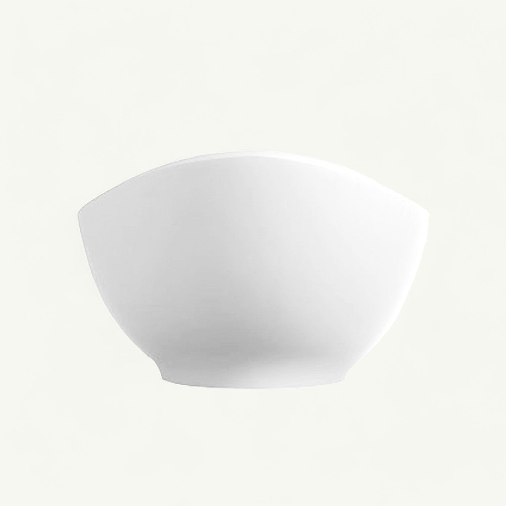 Magnus Hartland solid surface stone resin freestanding bathtub in matte white — end/side profile showing one raised curved end and the tapered base, on a white background.
